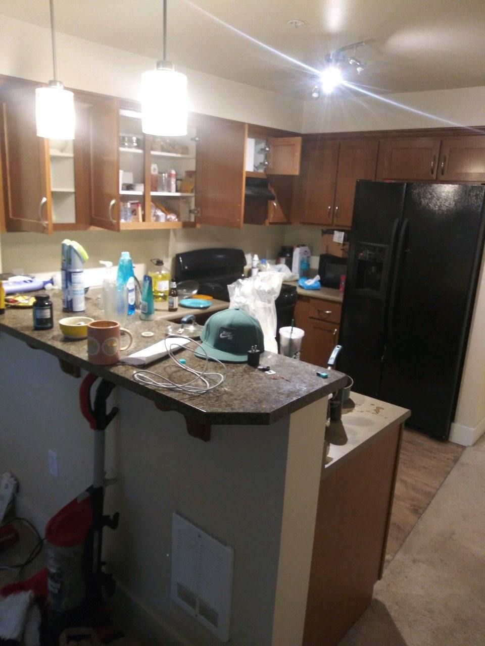 Kitchen counters piled with belongings before a cleanout
