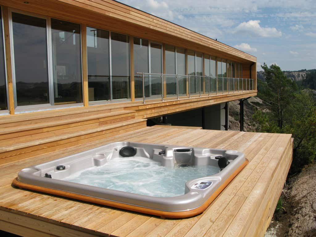 Hot tub on outdoor deck ready for removal in Seattle