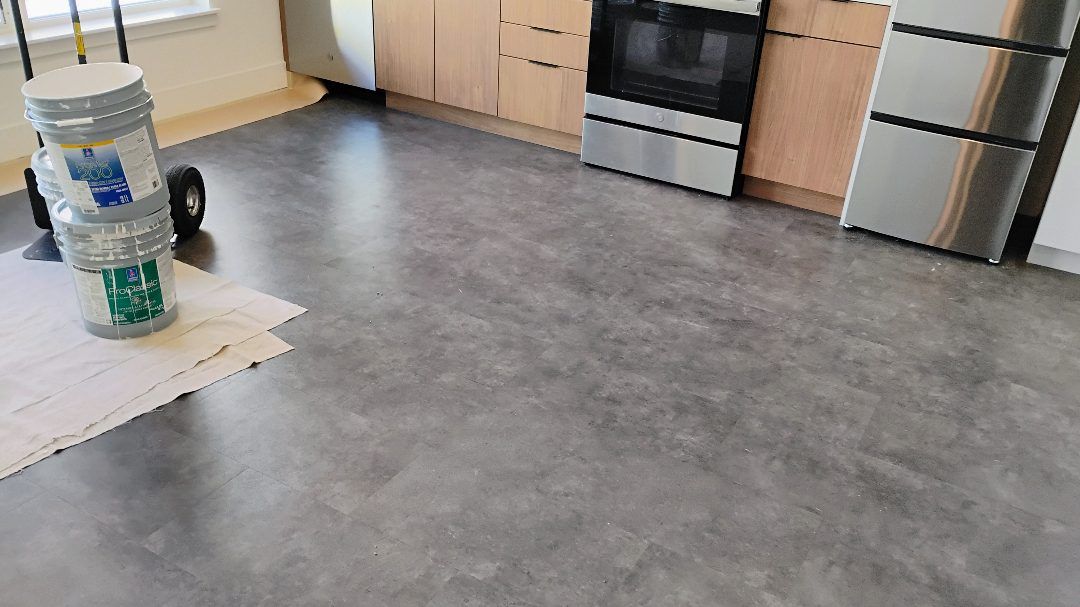 Apartment kitchen cleared over polished concrete floors at Hilite Apartments, Seattle