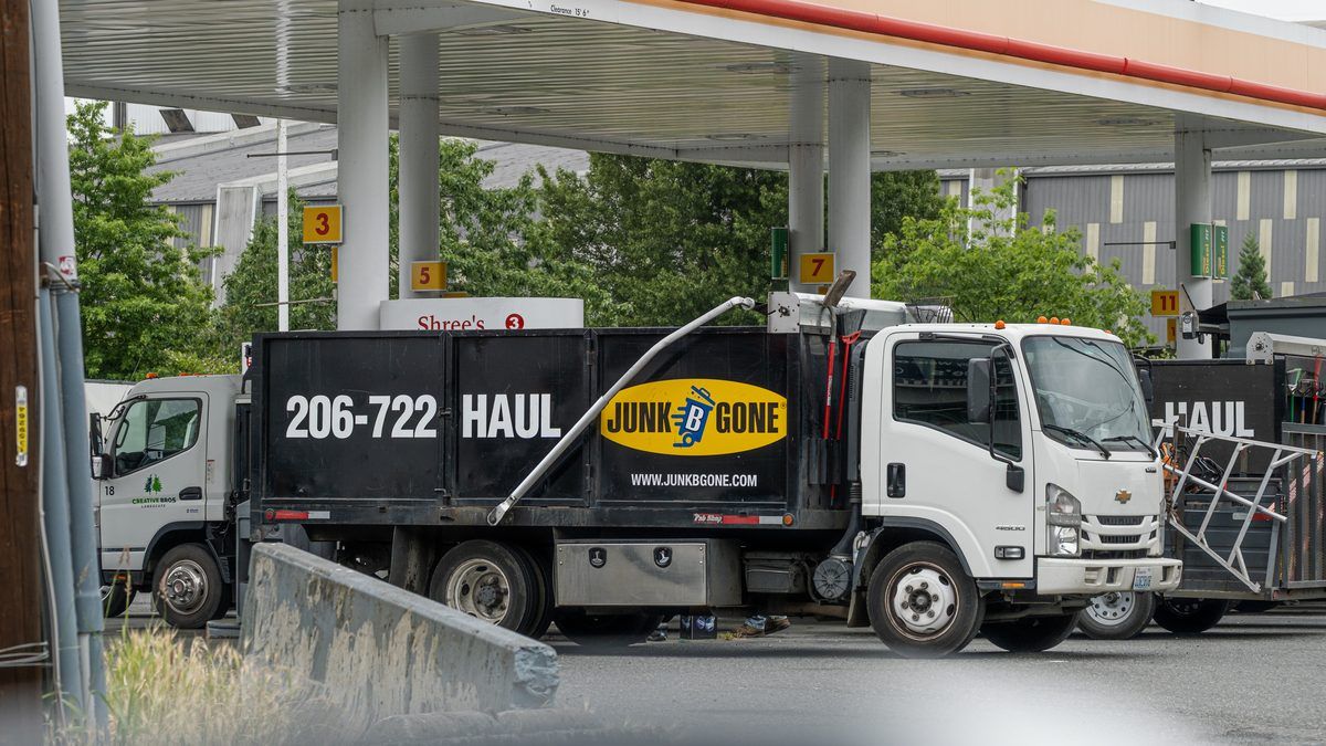 Junk B Gone branded truck parked at a Seattle residential home for an estate cleanout