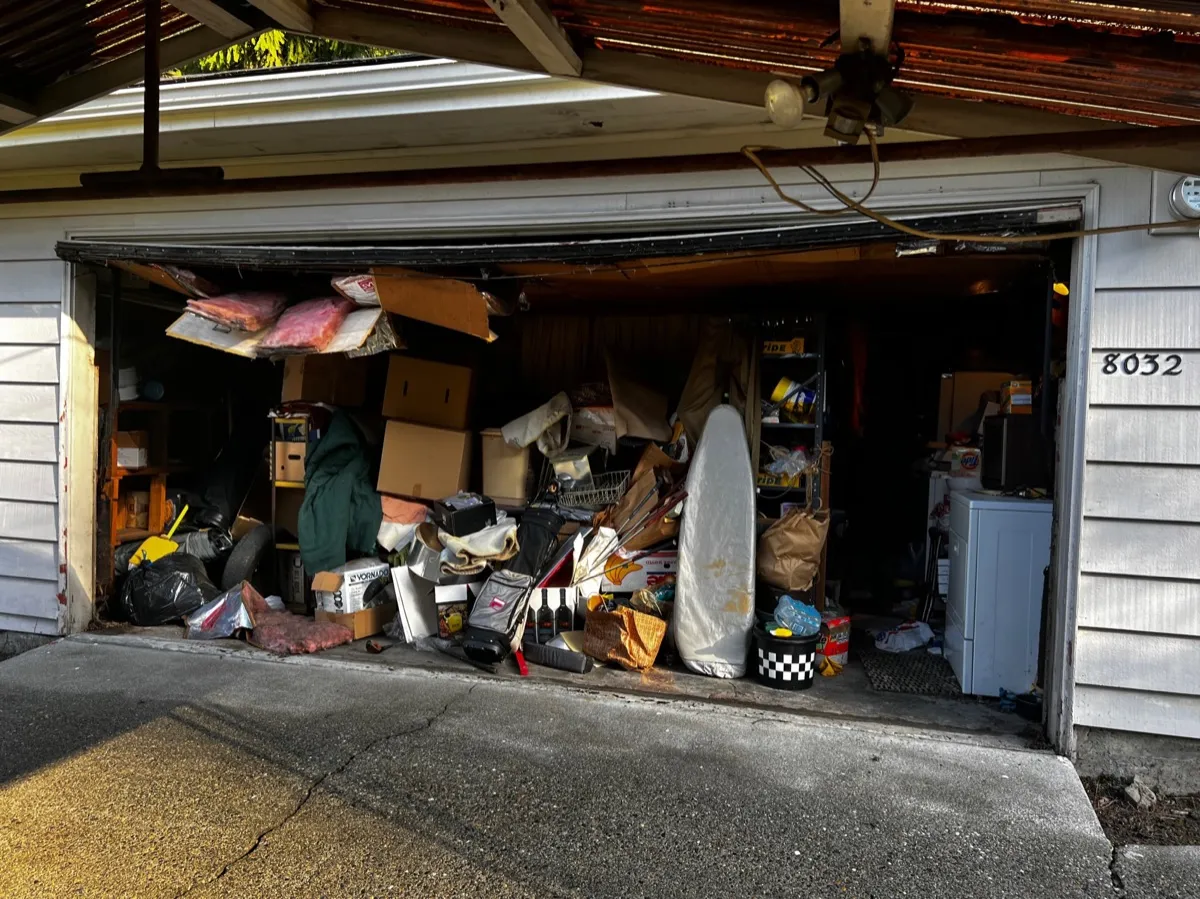 Before — Garage packed with decades of belongings
