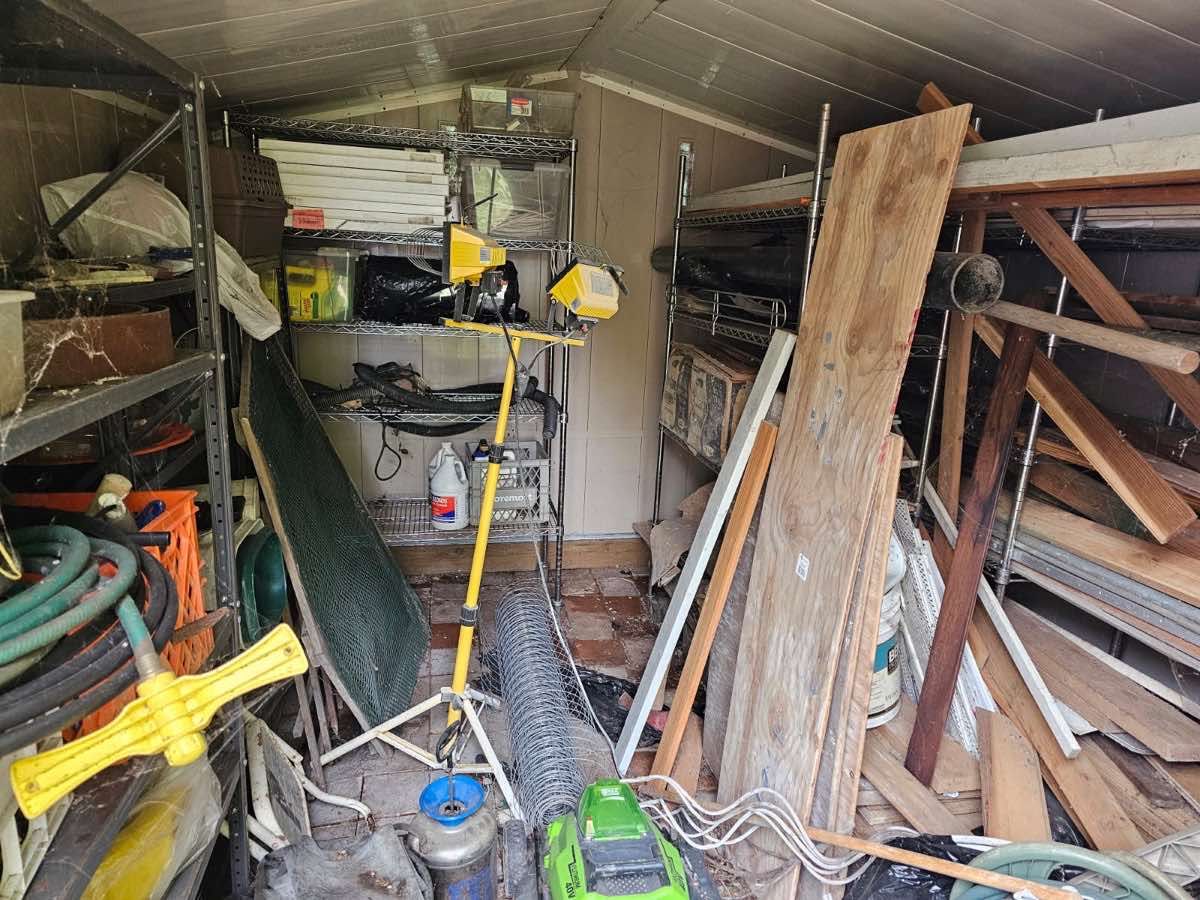 Sort and Haul Day in Bellevue - a packed storage shed before the Junk B Gone crew cleared it