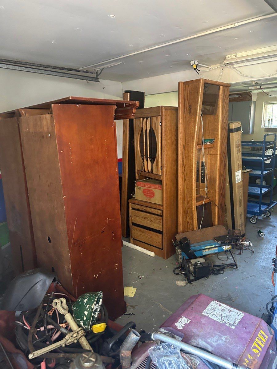 Furniture stacked two deep in a Kent garage