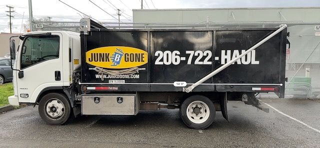 Junk B Gone truck with logo and 206-722-HAUL phone number
