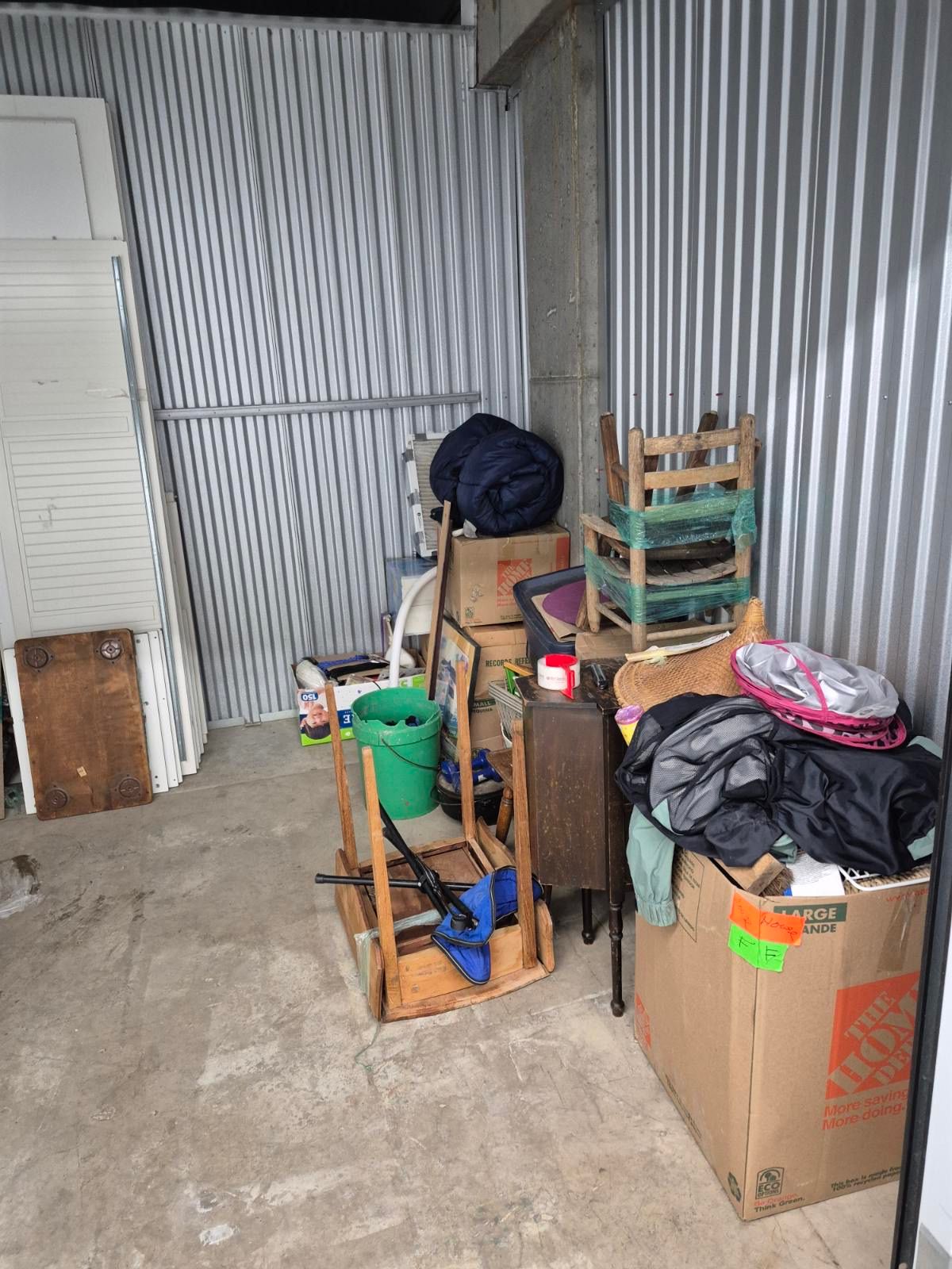 Chairs, a table, boxes and clothing in a Seattle storage unit during the haul
