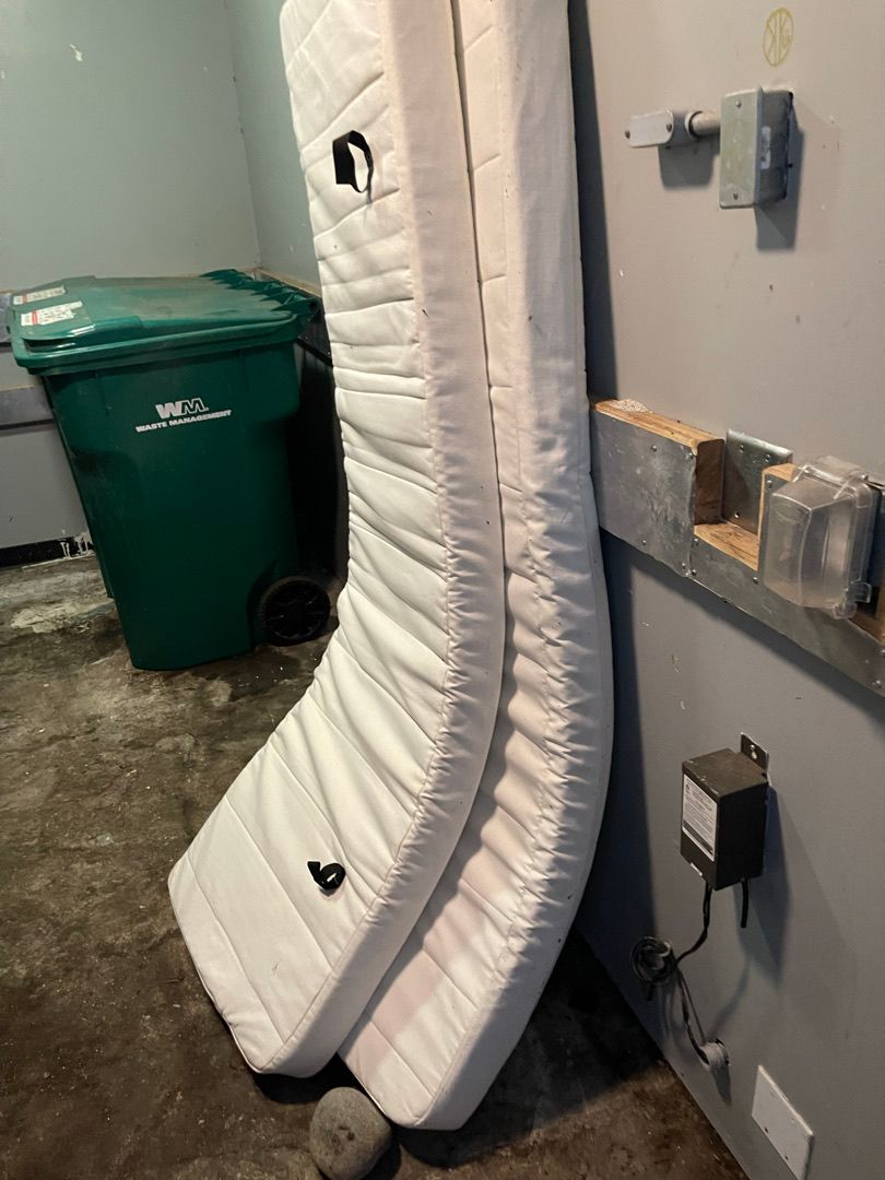 Mattress in a storage room before junk removal at a Seattle rental