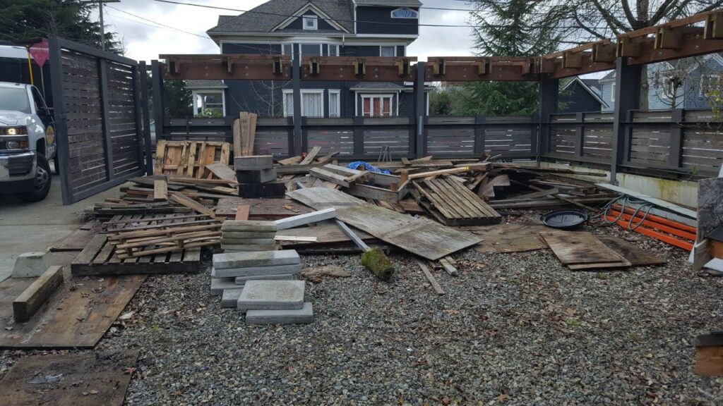 Junk B Gone truck on site at a residential construction debris removal project in Seattle