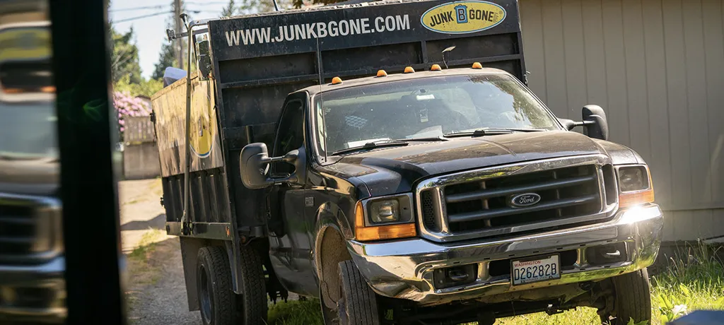Junk B Gone truck parked outside of a junk removal project in Seattle