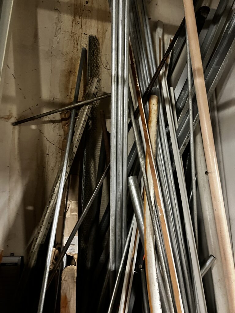 Junk scrap metal removal in seattle photo of a bunch of pipes in the corner of a basement