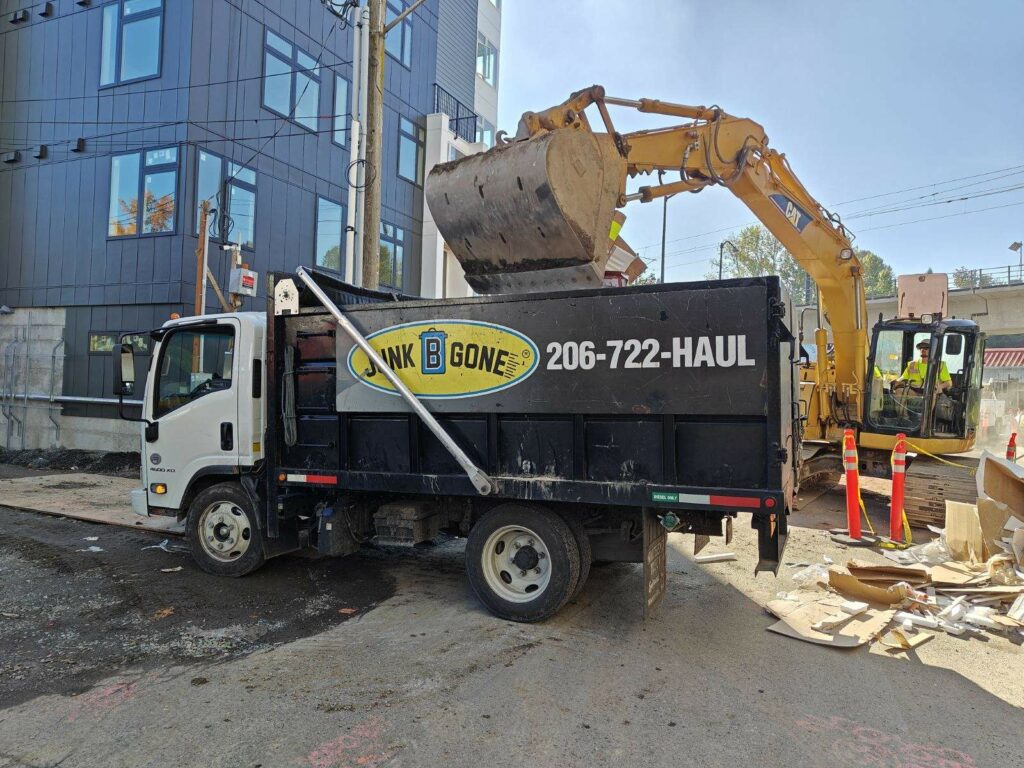 commercial parter loading a junk removal truck in Seattle