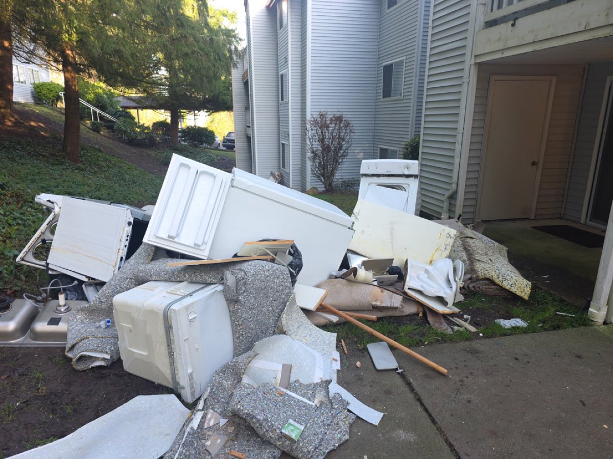 More angles of remodel debris outside building